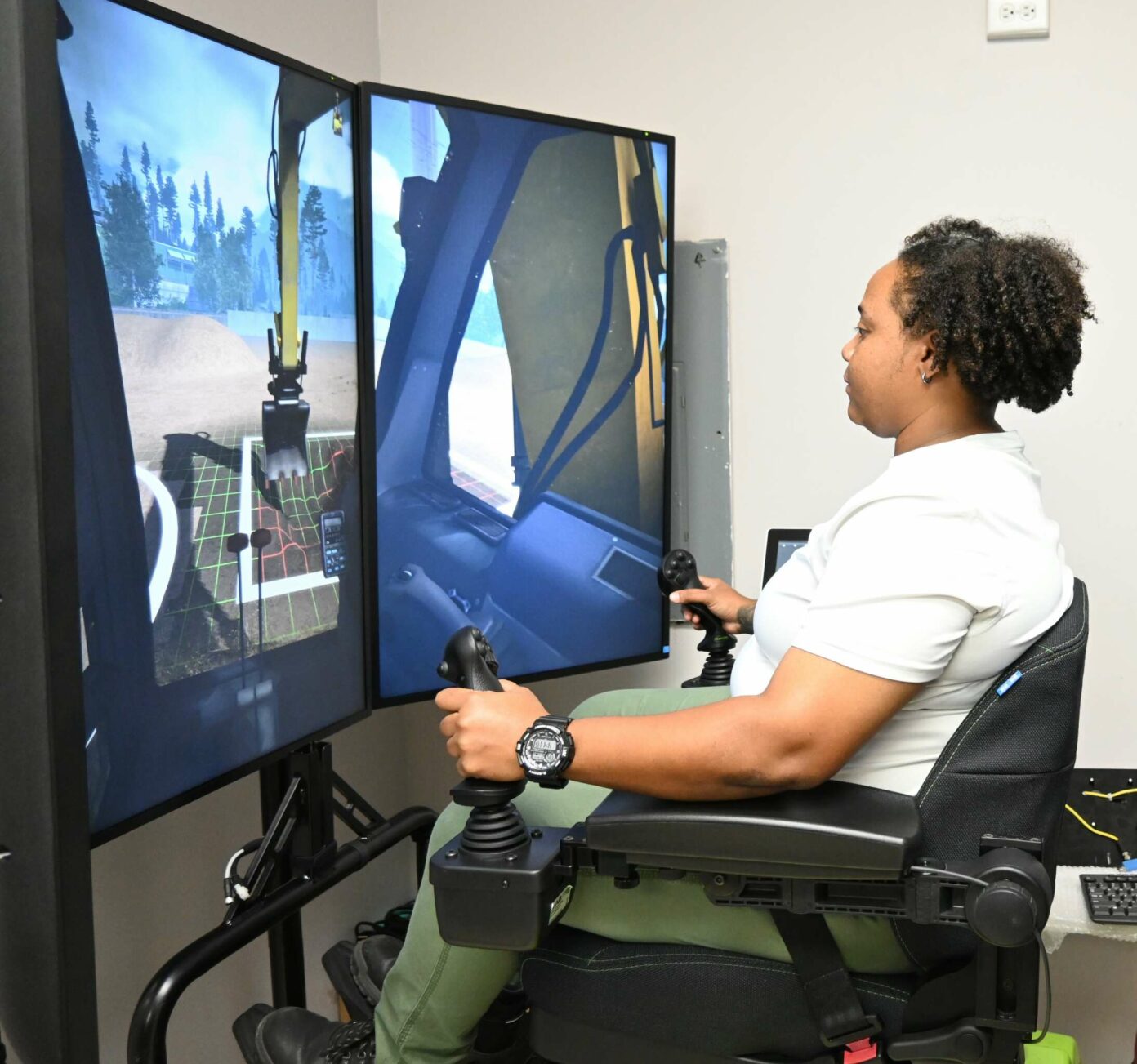 Inspire Cayman trainee Chrystal Bush going through her training on the heavy equipment simulator. – Photo: Reshma Ragoonath